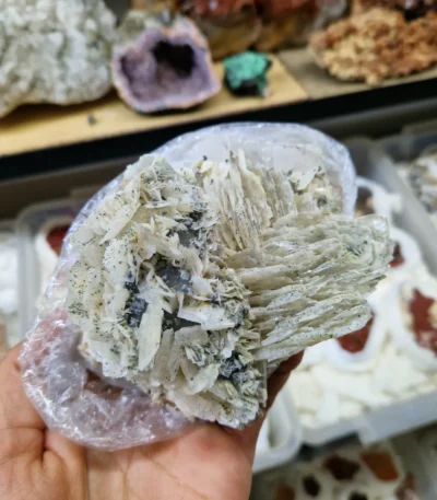 Natural Barite (Baritine) mineral specimen with layered crystal formation and soft blue hue