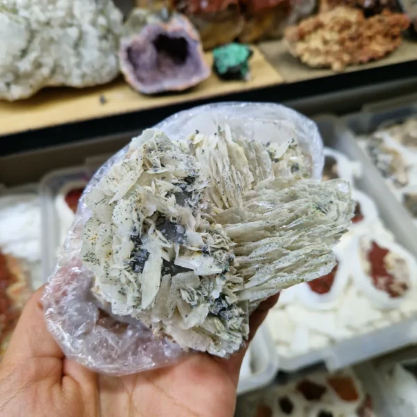 Natural Barite (Baritine) mineral specimen with layered crystal formation and soft blue hue